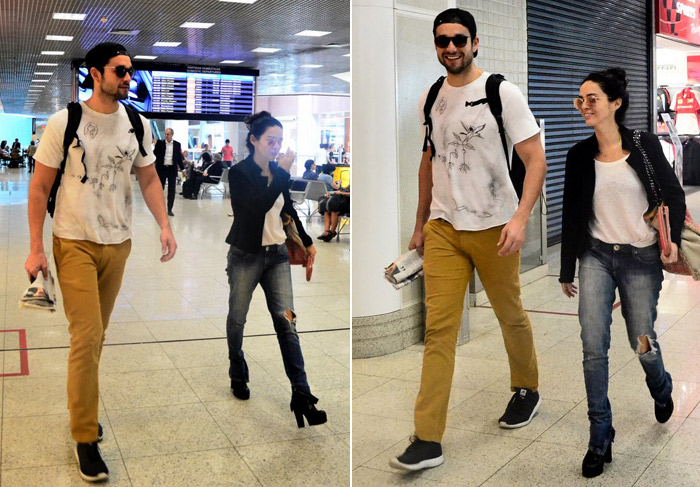 Sérgio Marone e Cláudia Ohana embarcam juntos em aeroporto carioca