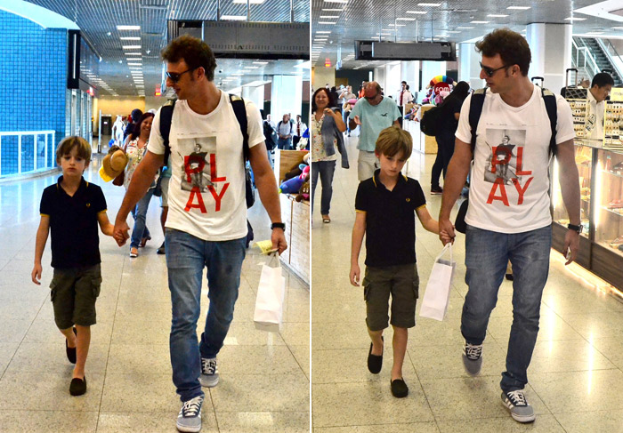 Cassio Reis embarca de mãos dadas com o filho no Rio de Janeiro