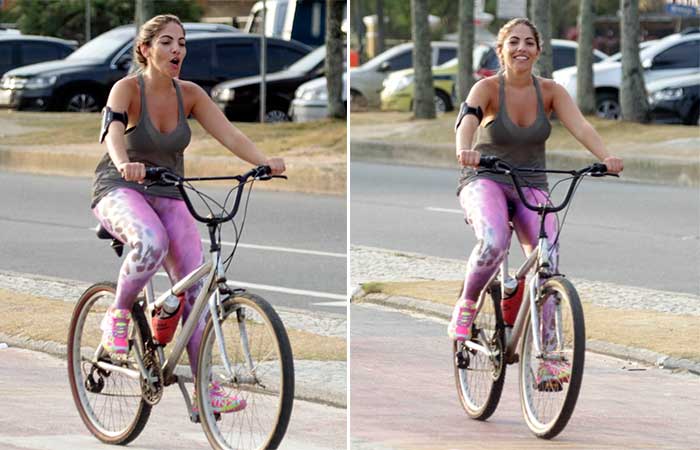 Ex-BBB Anamara pedala sorridente pela orla da Barra da Tijuca