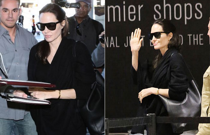 Angelina Jolie distribui autógrafos em aeroporto de Los Angeles