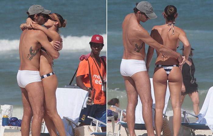Giba confere biquíni da mulher em dia de praia no Rio