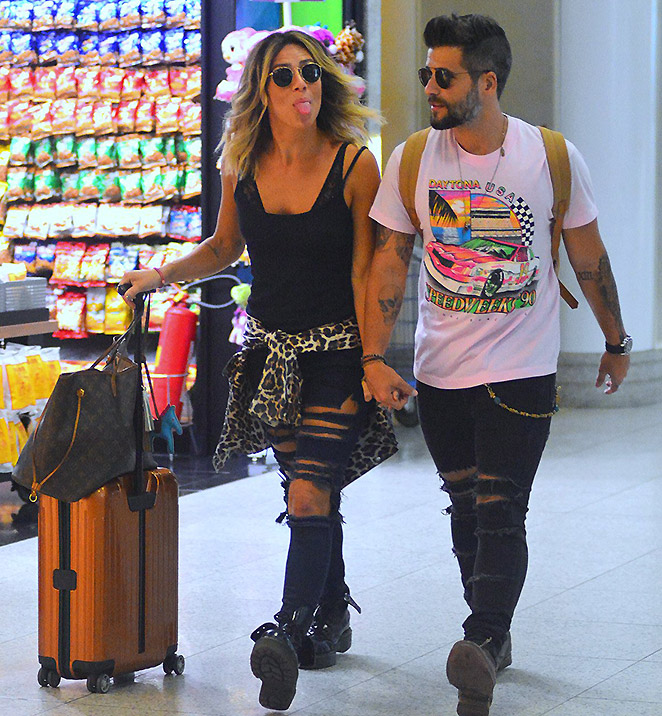 Esbanjando estilo, Giovanna Ewbank e Bruno Gagliasso embarcam em aeroporto no Rio