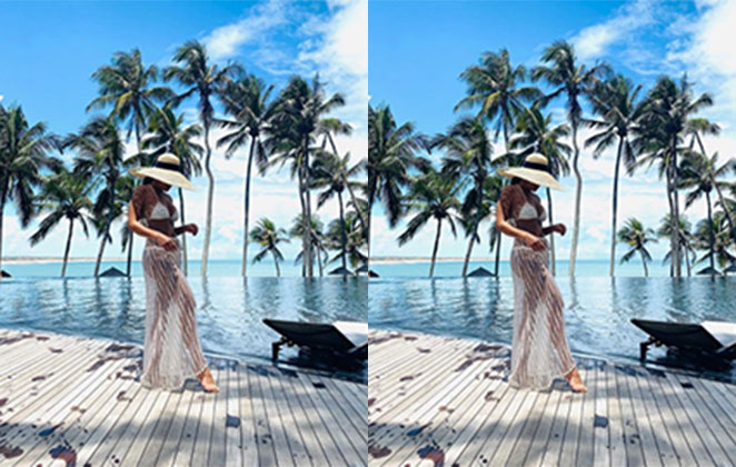 Juliana Paes com biquíni branco e saída de praia transparente