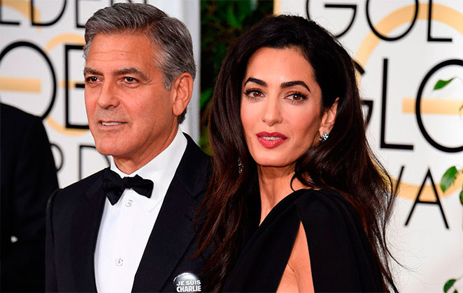 Amal Clooney e George Clooney em premiação