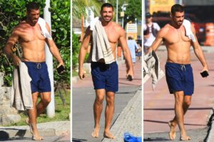 Cauã Reymond saindo da praia