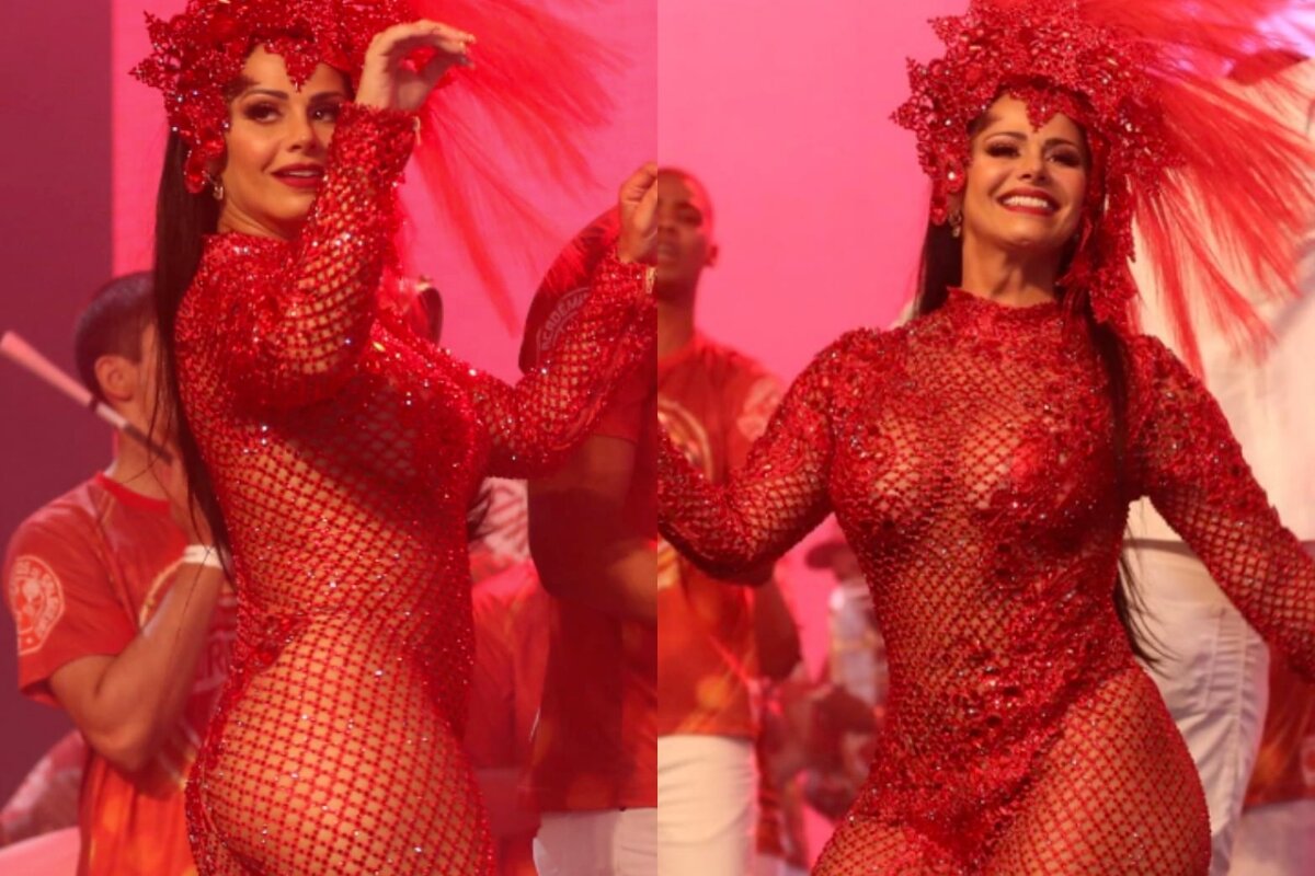 Viviane araújo de macacão vermelho transparente sambando no palco da Cidade do Samba