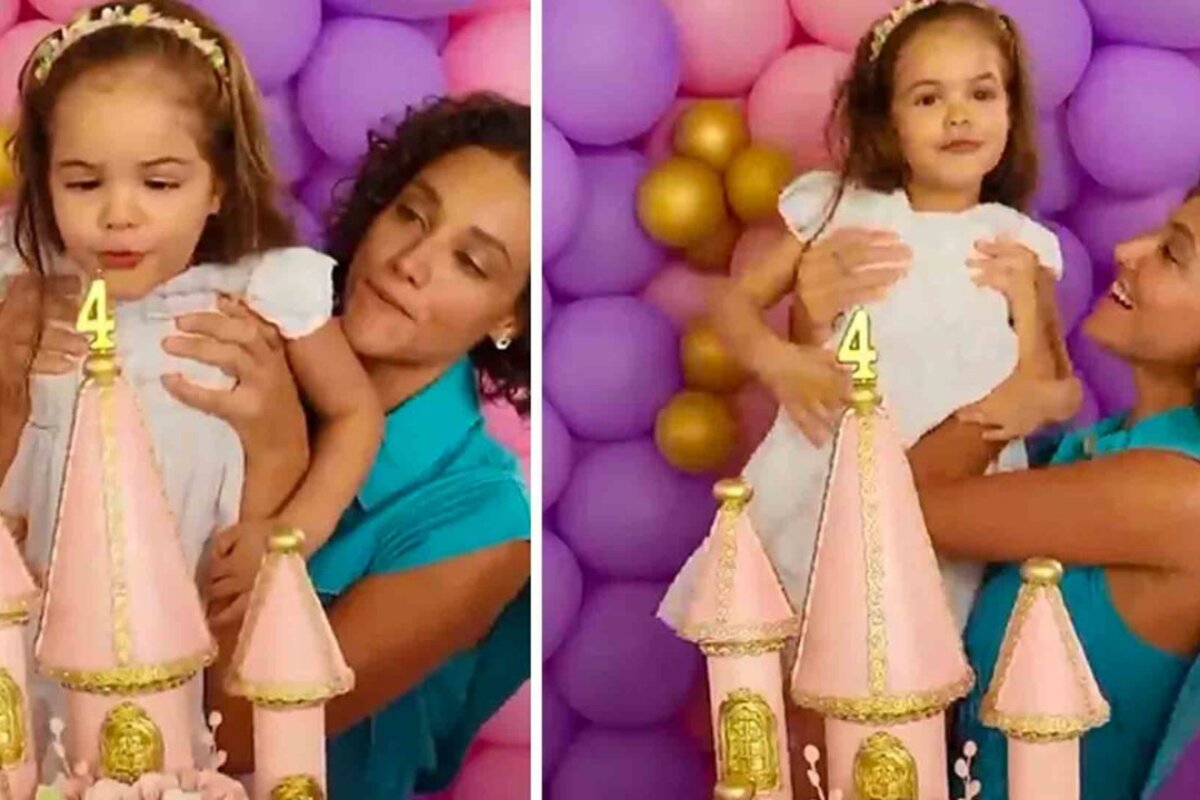 Debora Nascimento carregando a filha, Bella, na festa de aniversário