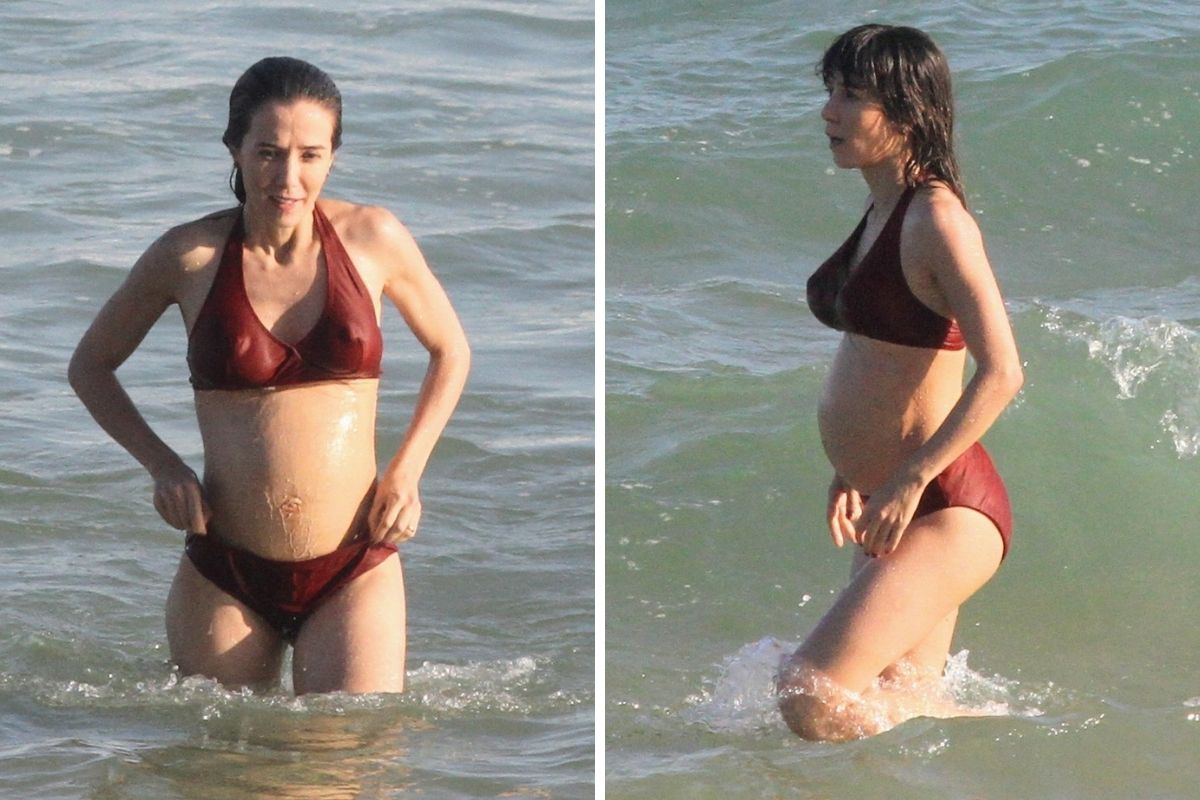Marjorie Estiano gravando na praia de Ipanema com barriga de grávida