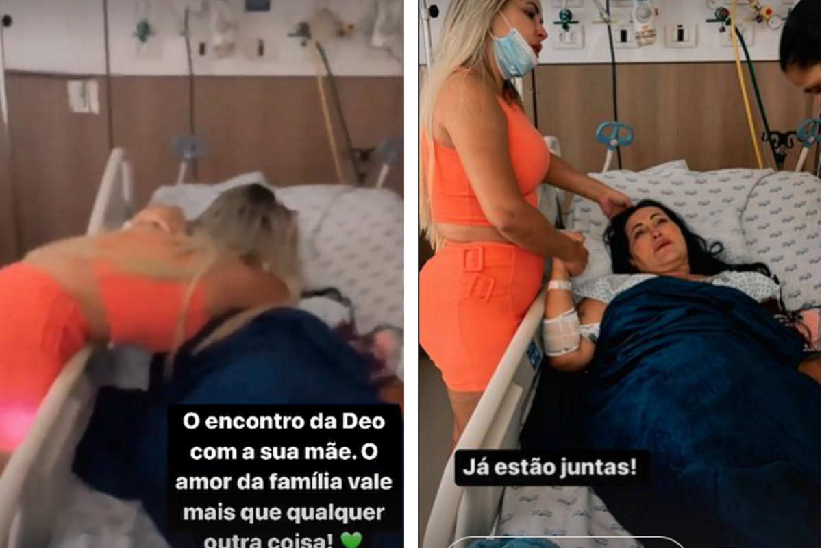 Deolane de macacão laranja com a mãe, Solange, que está deitava na cama do hospital