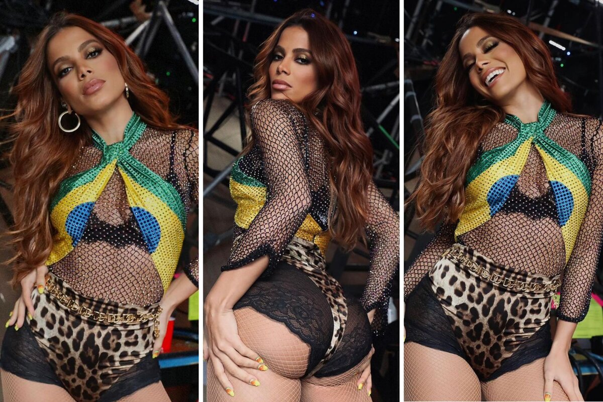 Anitta de short preto e top estilizado com estampa da bandeira do Brasil