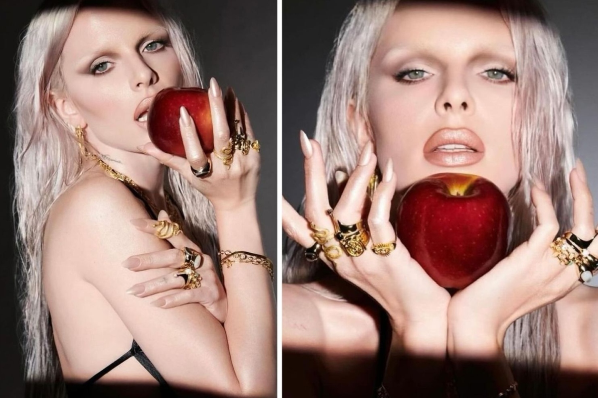 Julia Fox com uma maçã