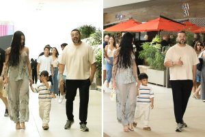 Rayane, o filho, e Belo passeiam no shopping